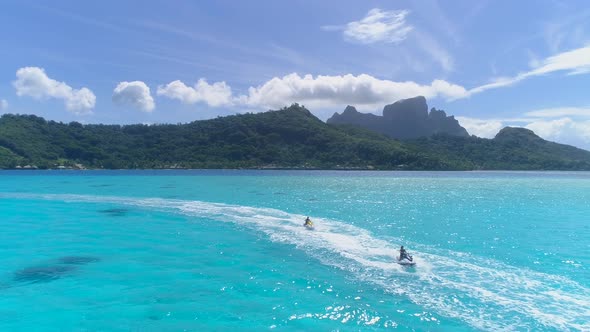 Aerial drone view of jetski personal watercraft in Bora Bora tropical island