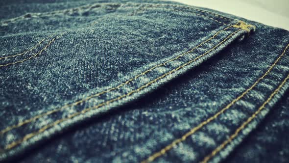 Extreme Detailed of Blue Denim Jeans Texture in Dolly Shot Over Cloth Surface