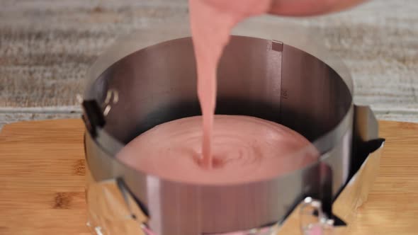 Pouring Berry Mousse Into Cooking Form. Step By Step French Mousse Cake Making Process.