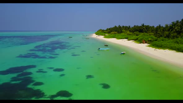 Aerial flying over texture of beautiful shore beach journey by blue lagoon with white sand backgroun