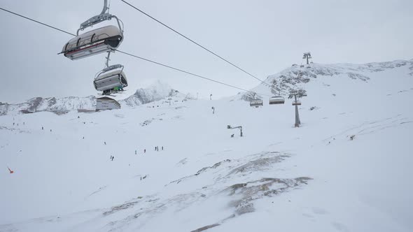 Chairlifts riding at a ski resort