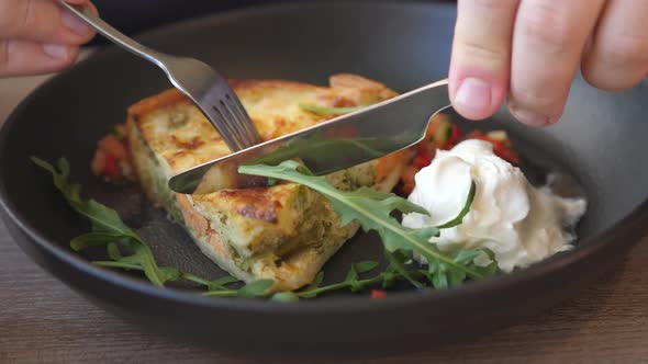 Woman Eating in Luxury French Restaurant Delicious French Quiche Aux Legumes and Salmon Vegetable