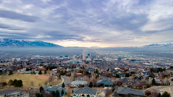 Salt Lake City valley on a overcast and smoggy morning - wide angle, parallax aerial hyperlapse
