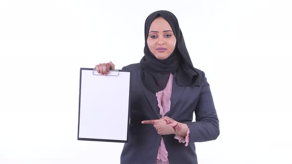 Happy Young African Muslim Businesswoman Showing Clipboard and Giving Thumbs Up