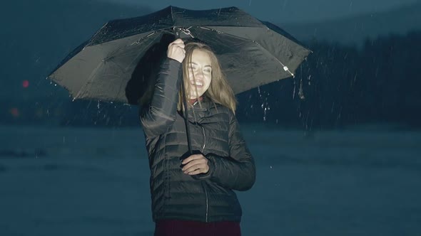 Happy Girl Poses with Umbrella in Evening Slow Motion