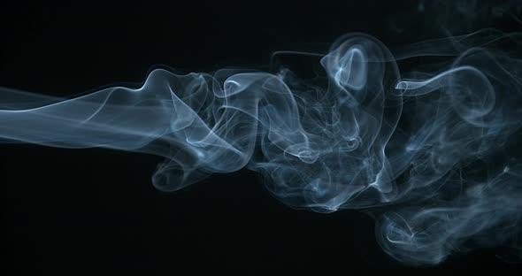 900428 Smoke of Cigarette rising against Black Background, Slow Motion 4K