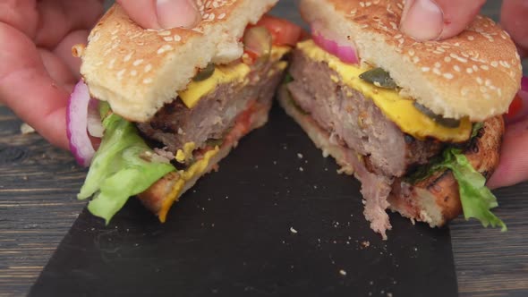 Closeup of the Delicious Homemade Grilled Burger with Cutlet Cut in Two Halves