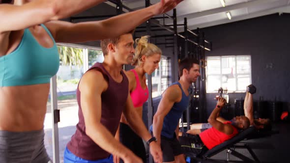 Group of people performing plyometrics exercise