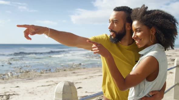 Couple interacting with each other at beach 4k