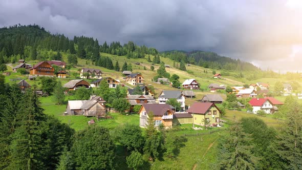 Flight Over a Mountain Village Among the Coniferous Forest