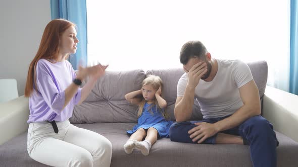 Young Caucasian Parents Argue at Home.
