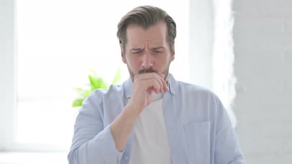 Portrait of Sick Young Man Coughing