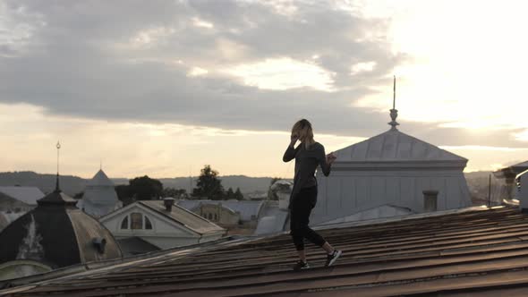 Woman dancing on the rooftop