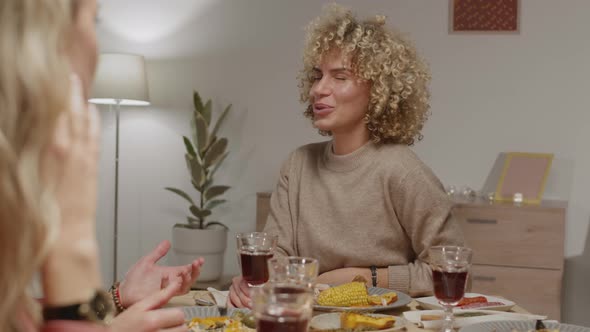 Portrait of Woman Dining with Friends