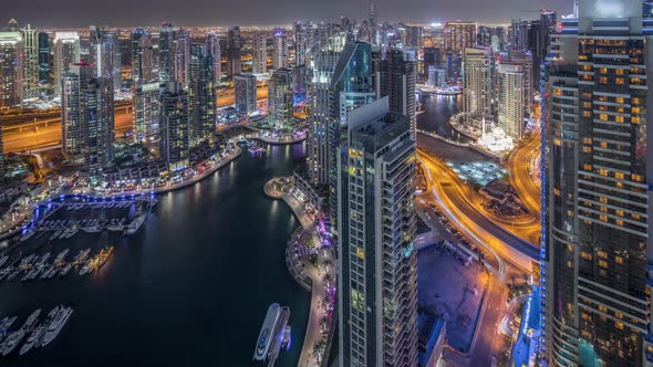 Dubai Marina Skyscrapers and Jumeirah Lake Towers View From the Top Aerial Night Timelapse in the