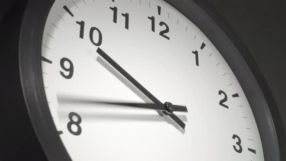 Clock Face In Time Lapse On Dark Grey Wall 