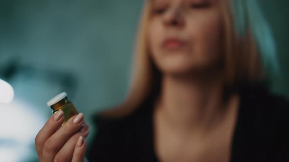 Smiling Woman Takes Dangerous Poison Sitting in Office