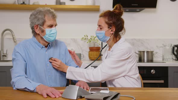 Therapist Wear White Coat Face Mask Due Corona Virus Pandemic Outbreak Talk to Elderly Patient