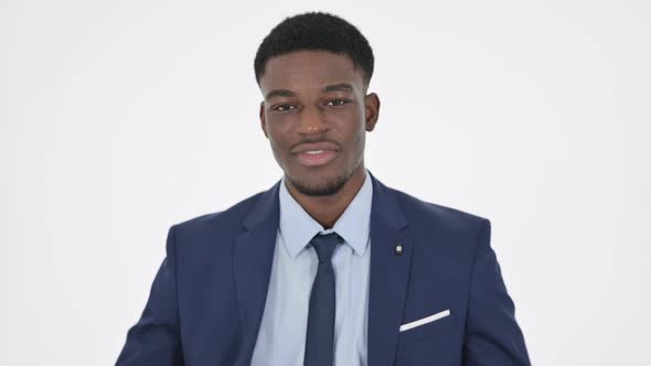 African Businessman Showing Victory Sign on White Background