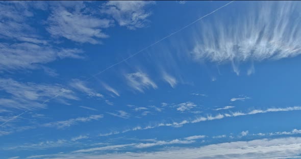 Amazing View of White Fluffy Clouds Moving Softly on Bright Blue Sky