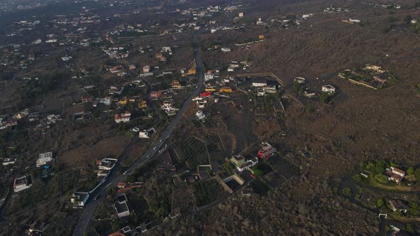 Fields covered with volcanic ash on La Palma island. Aerial tilt up reveal