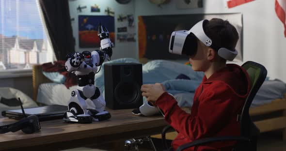 Boy Playing with His Toy Robot