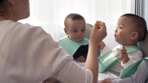 1-Year-Old Identical Twins Eating Baby Food