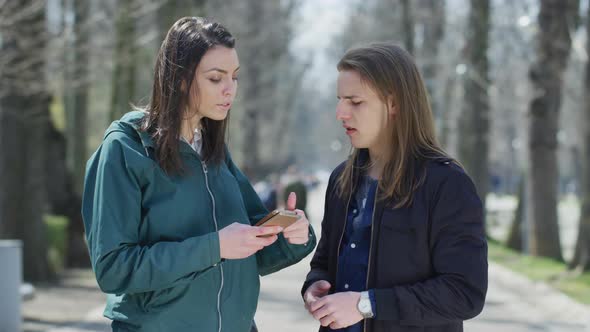 Friends meeting in a park