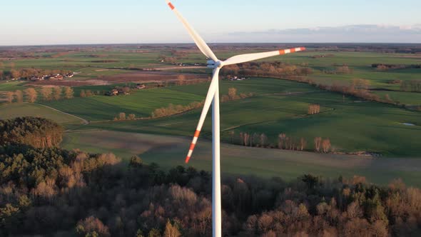 Wind turbine generator from above during sunset, Green eneregy, Aerial shots from drone