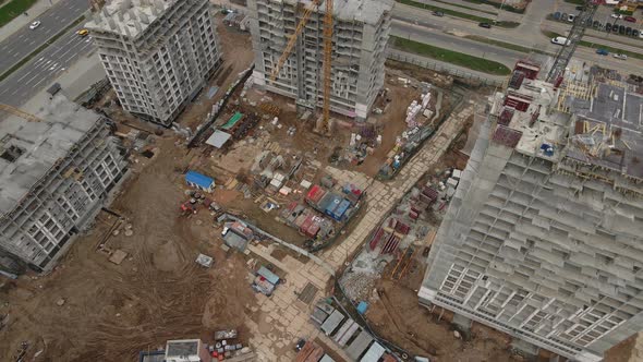 Flying Over A Construction Site In An Arc. Modern Urban Development. alt