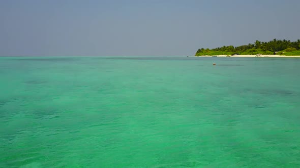 Aerial scenery of shore beach voyage by blue sea with sand background