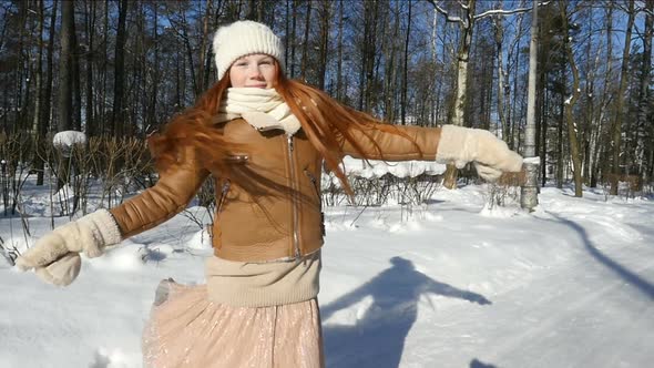 Redhead Teenage Girl, Child Having Fun On Winter Walk. Happy Teen Girl Spinning In Winter Park
