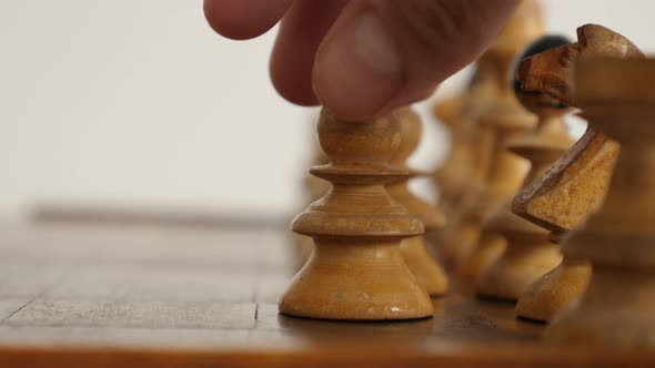 Moving pawn in  chequered fields  strategic  game 4K 2160p 30fps UltraHD  footage - Wooden chess set