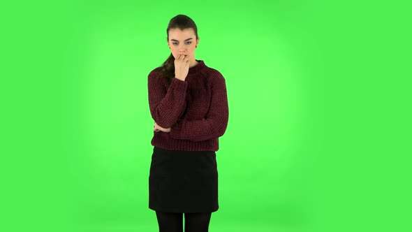 Young Girl Thinks About Something. Green Screen