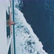 Young woman leaning over the edge of ship from above - VideoHive Item for Sale