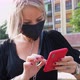 Woman wearing mask using smart phone - VideoHive Item for Sale