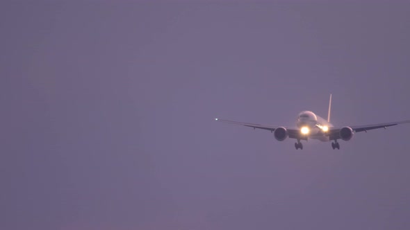 Airplane Approaching Over Ocean at Sunset Backgfround