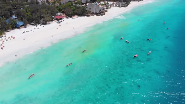 Aerial Paradise Sandy Beach with Turquoise Ocean and Luxury Hotels in Zanzibar