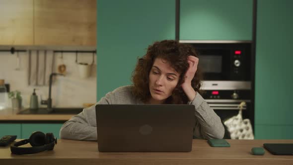 Bored 20s Adult Student Can't Focus on Her Work on a Laptop and Closing It