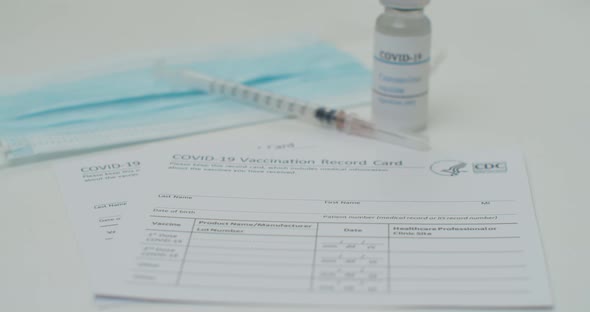 Medical Mask and COVID19 Vaccine on Vaccination Record Card Approved By CDC with Corona Virus