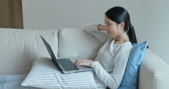 Woman use of laptop computer at home