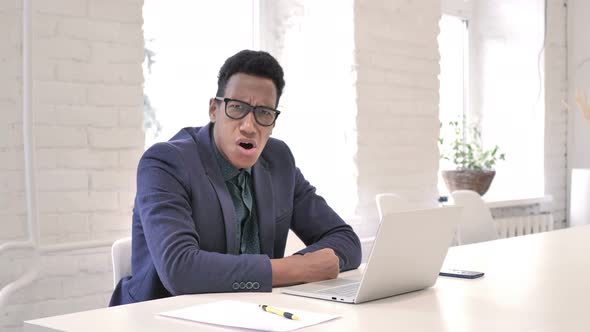 Shocked Businessman Wondering at Work Looking at Camera