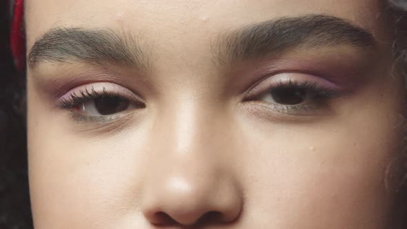 Closeup Slow Motion African American Girl Eyes Look Friendly and Upbeat Smiling Modest and Joyful