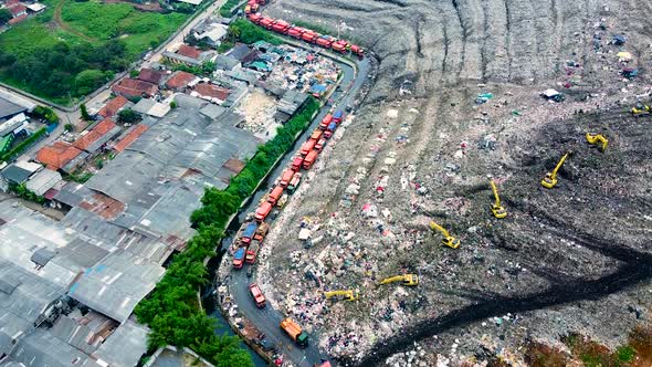 Aerial View. Large landfills like mountains. the tractor take garbage on landfills