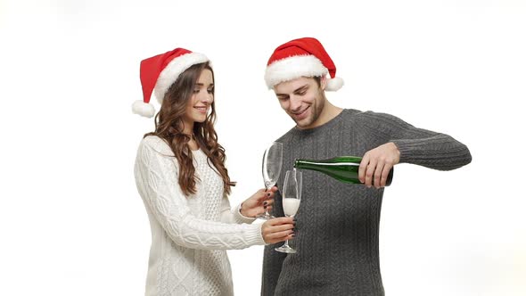 Slow-motion Young Couple Enjoy Drinking Champagne Celebrate for Christmas Fun Together Feeling