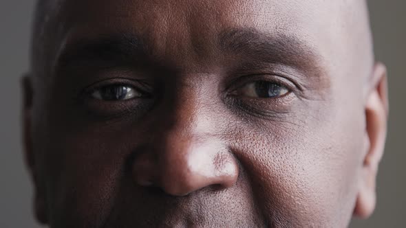 Closeup Sad Black Male Eyes Looking at Camera African Mature Elderly Man Suffering From Poor