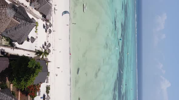 Vertical Video Boats in the Ocean Near the Coast of Zanzibar Tanzania Aerial View