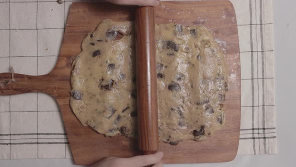 Roll Out Cookie Dough With A Wooden Rolling Pin At The Kitchen. - Top-down Shot