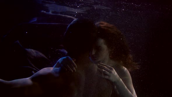 Naked Lovers Underwater in Dark Aquarium, Love and Sex in Swimming Pool
