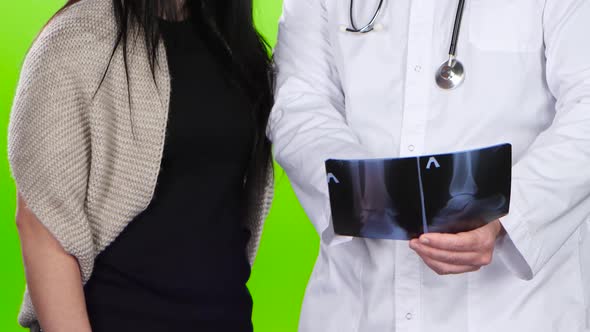 Patient of Clinic Doctor Showing an X-ray Picture, Green Screen